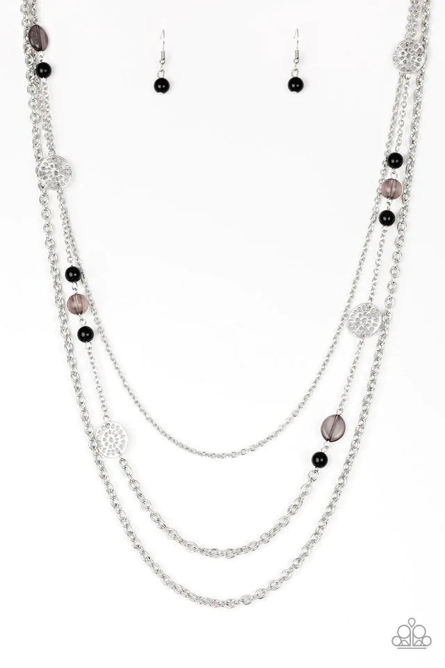 Paparazzi Accessories Pretty Pop-tastic! - Black Ornate silver accents, glassy beads, and polished black beads trickle along strands of shimmery silver chains for a whimsical look. Features an adjustable clasp closure. Sold as one individual necklace. Inc