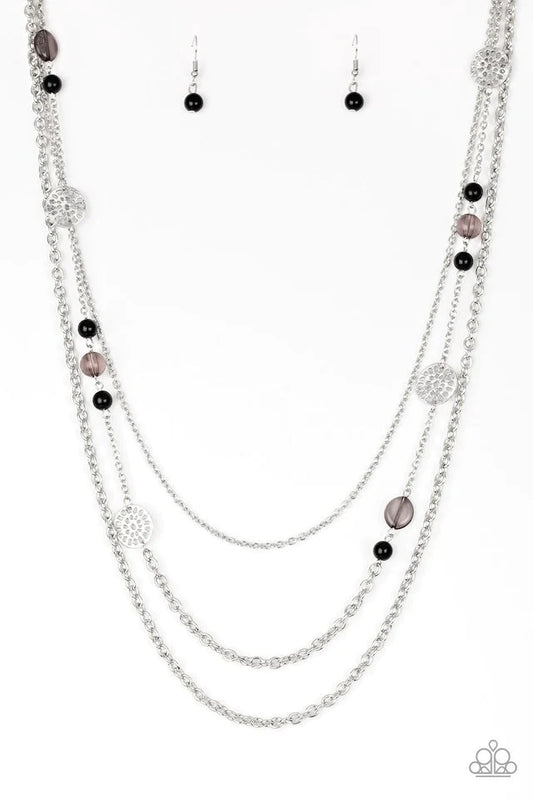 Paparazzi Accessories Pretty Pop-tastic! - Black Ornate silver accents, glassy beads, and polished black beads trickle along strands of shimmery silver chains for a whimsical look. Features an adjustable clasp closure. Sold as one individual necklace. Inc