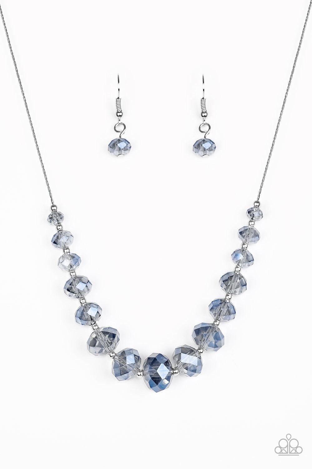 Paparazzi Accessories Crystal Carriages - Blue Iridescent blue crystal-like beads and dainty silver beads are threaded along a flat silver chain below the collar. The sparkling crystal-like beads gradually increase in size near the center for a refined fi