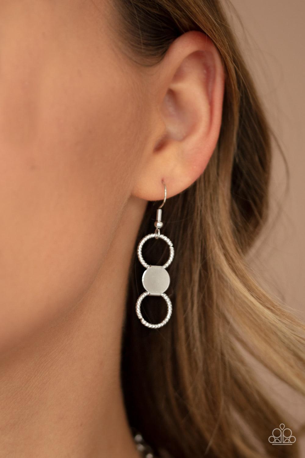 Paparazzi Accessories Net Result - Silver An interlocking net of textured silver rings and reflective silver discs link into a dramatically netted fringe below the collar. Features an adjustable clasp closure. Jewelry