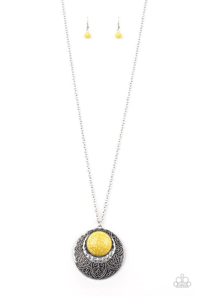 Paparazzi Accessories Medallion Meadow - Yellow Swinging from the bottom of a lengthened silver chain, a sunny yellow stone is pressed into a hammered silver medallion radiating with floral details for a bold tribal inspired look. Features an adjustable c