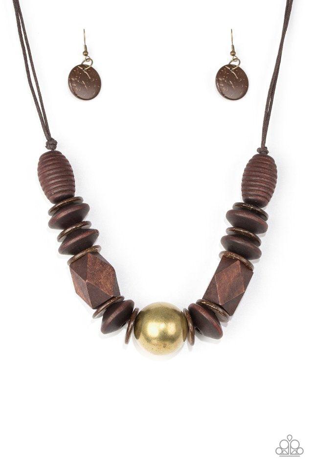 Paparazzi Accessories Grand Turks Getaway - Brass Featuring abstract geometric finishes, mismatched brown wooden beads are threaded along shiny brown cording. A dramatic copper bead adorns the center, creating a bold seasonal look below the collar. Featur