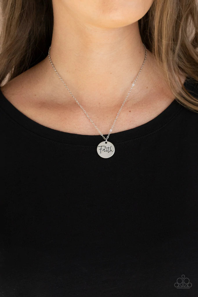 Paparazzi Accessories Choose Faith - Silver A dainty silver disc is stamped in the word, "Faith," at the bottom of a shiny silver chain, creating an inspiring pendant below the collar. Features an adjustable clasp closure. Sold as one individual necklace.