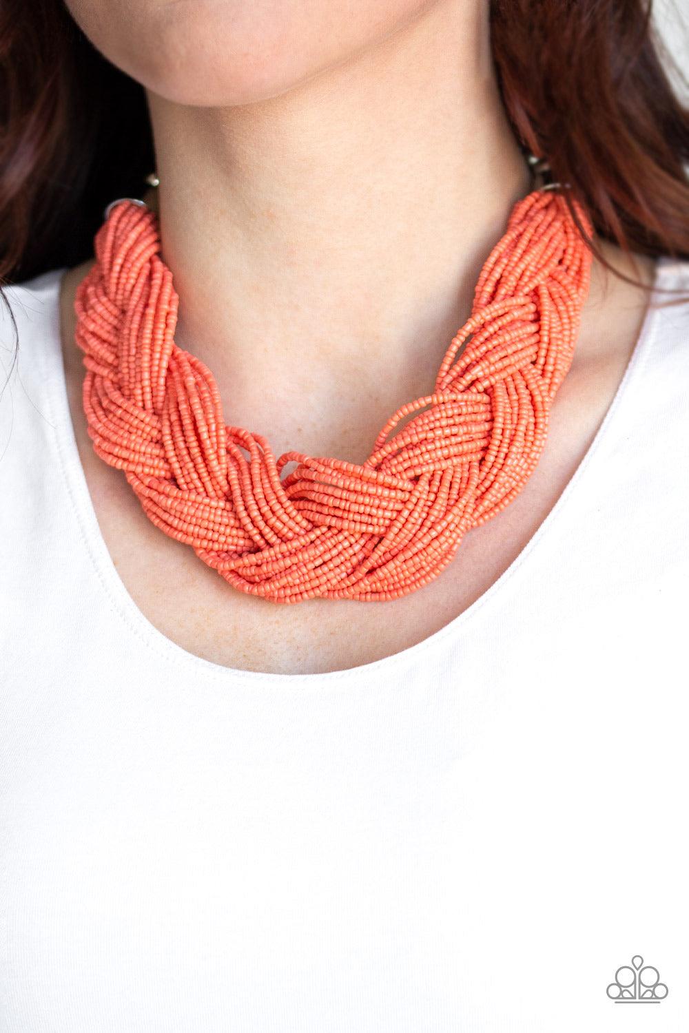 Paparazzi Accessories The Great Outback - Orange Brushed in a refreshing coral hue, countless seed beads weave into an indigenous braid below the collar. The colorful strands attach to large silver beads, adding a hint of metallic shimmer to the playful d