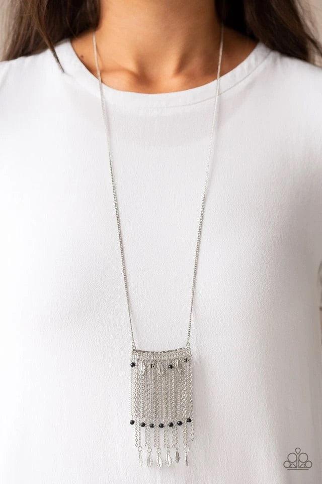 Paparazzi Accessories On The Fly - Black Attached to a lengthened silver chain, a hammered silver bar gives way to a fringe of shimmery silver chain, dainty black beads, and silver feather frames for a seasonal look. Features an adjustable clasp closure.