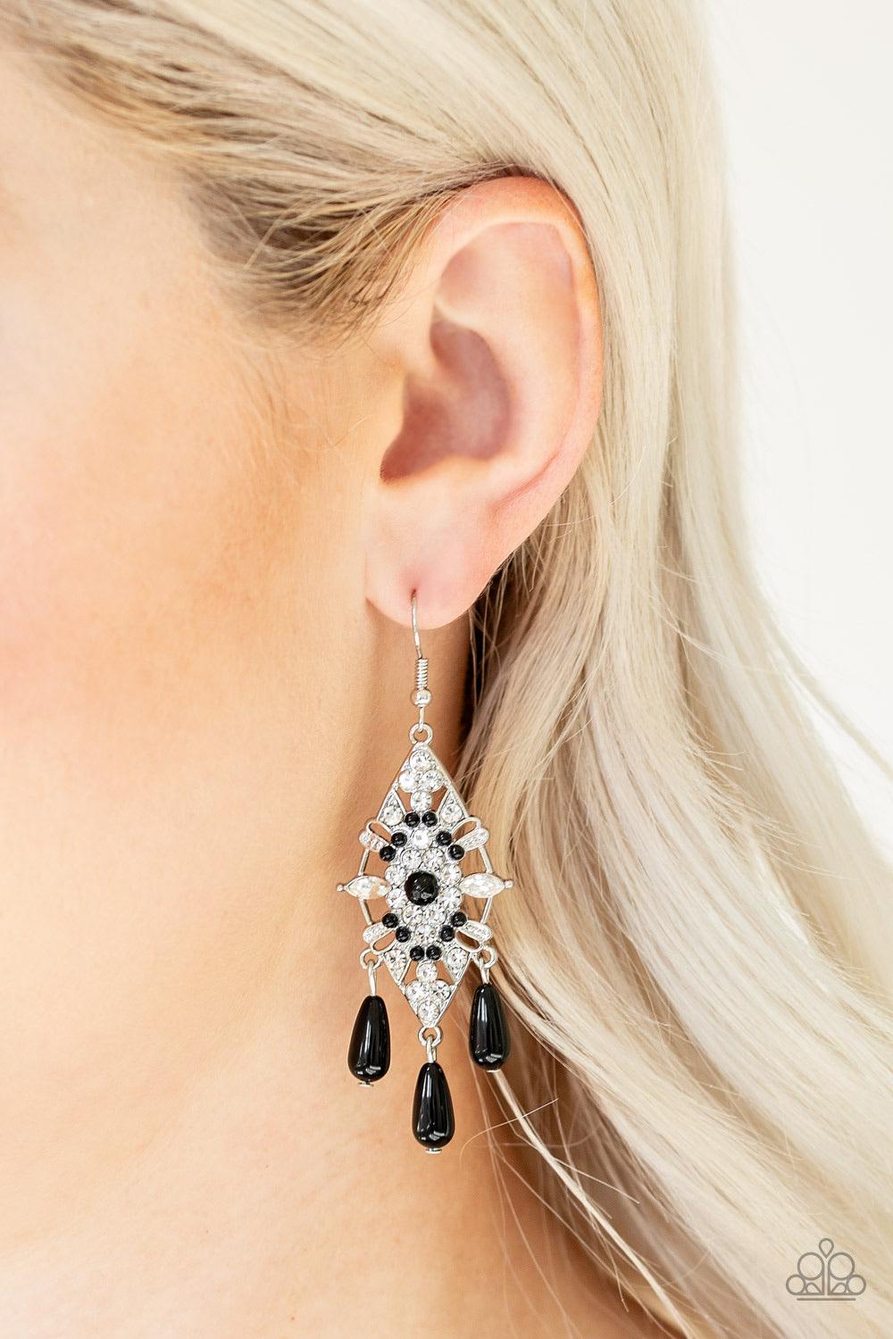 Paparazzi Accessories Majestic Mood - Black Dotted with dainty black beads, a silver kite-shaped frame is encrusted in glassy white rhinestones. Shiny black beads swing from the bottom of the sparkling frame for a refined flair. Earring attaches to a stan