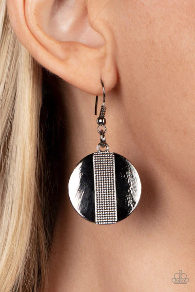 Paparazzi Accessories Metallic Enchantress - Black Three curved gunmetal bars, stamped in studded texture accents, connect to a gunmetal chain across the collar. An oversized gunmetal disc, divided down the center with texture, swings from the bottom resu
