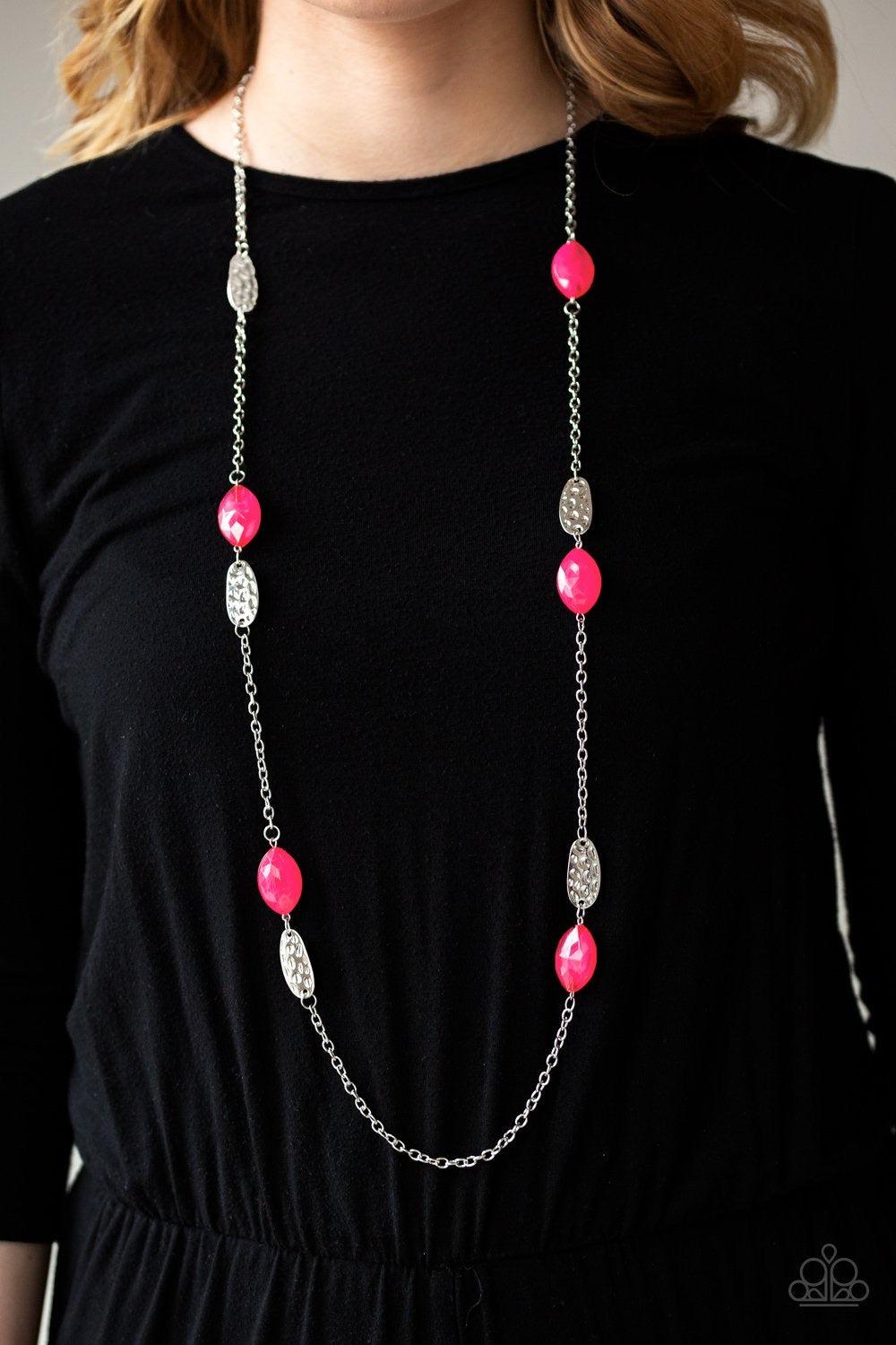 Paparazzi Accessories Beachfront Beauty - Pink Featuring an opaque finish, glassy pink beads join hammered silver frames along a shimmery silver chain, creating a colorful collision across the chest. Features an adjustable clasp closure. Jewelry