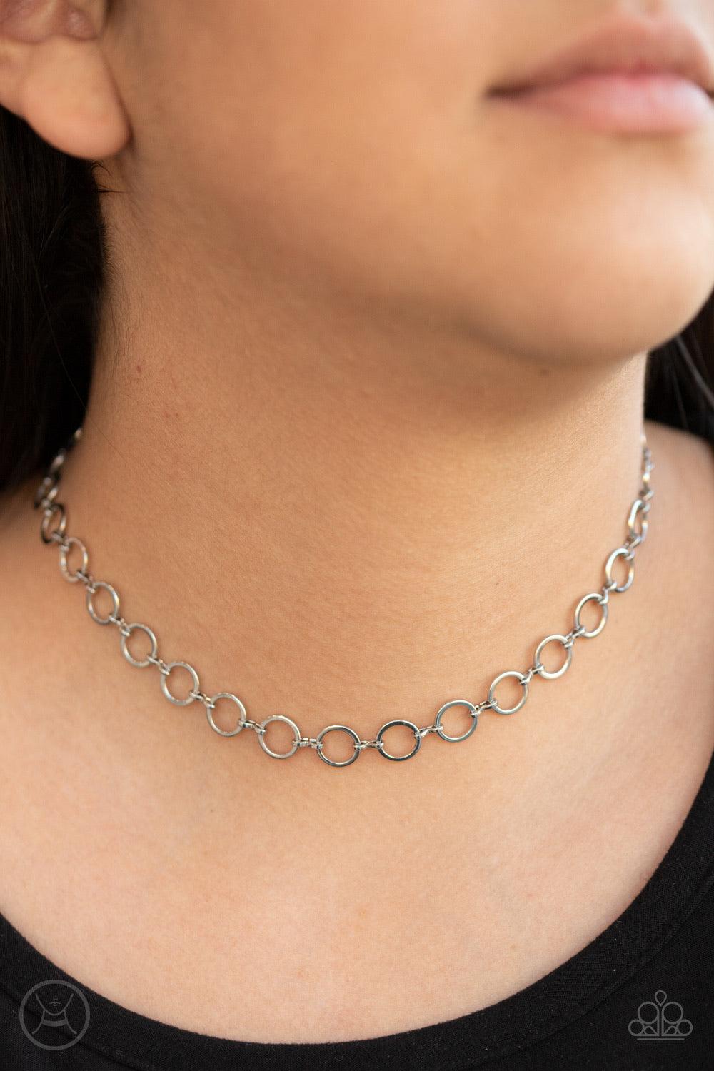 Paparazzi Accessories Roundabout Radiance - Silver Dainty silver rings link around the neck for a minimalist inspired shimmer. Features an adjustable clasp closure. Jewelry