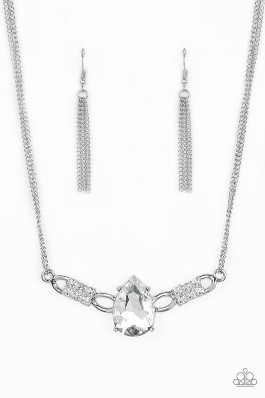 Paparazzi Accessories Way To Make An Entrance - White Cut into an alluring teardrop, an oversized white rhinestone gem attaches to bold silver frames radiating with glassy white rhinestones. The dramatic pendant attaches to doubled silver chains, swinging