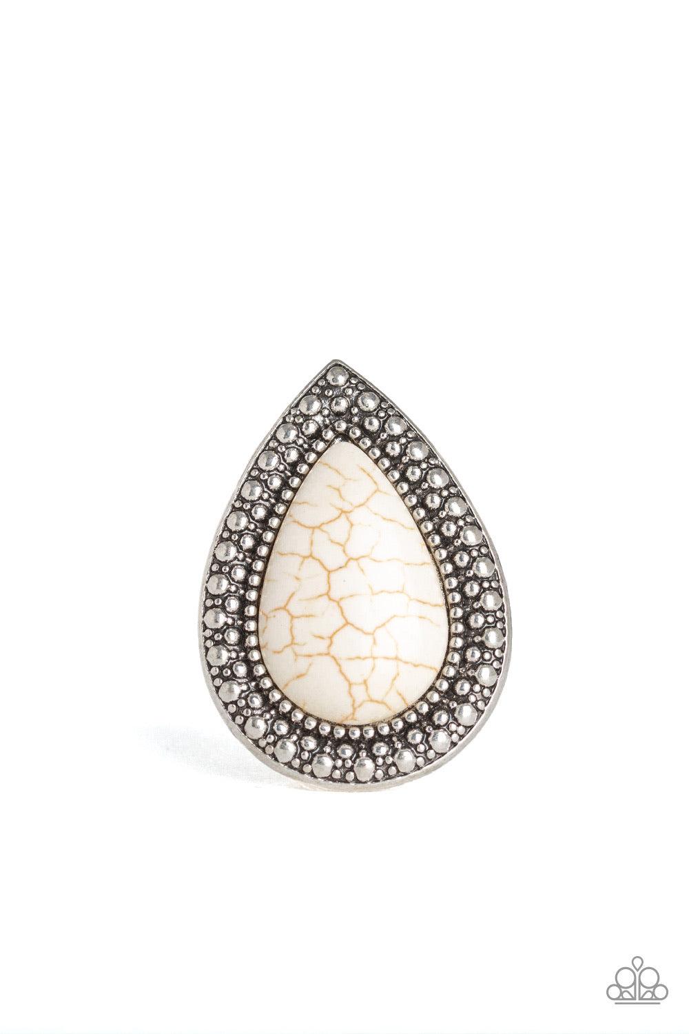 Paparazzi Accessories Santa Fe Storm - White Chiseled into a tranquil teardrop, an oversized white stone is pressed into the center of a shimmery silver frame dotted with radiant studded texture for a dramatic stone look. Features a stretchy band for a fl