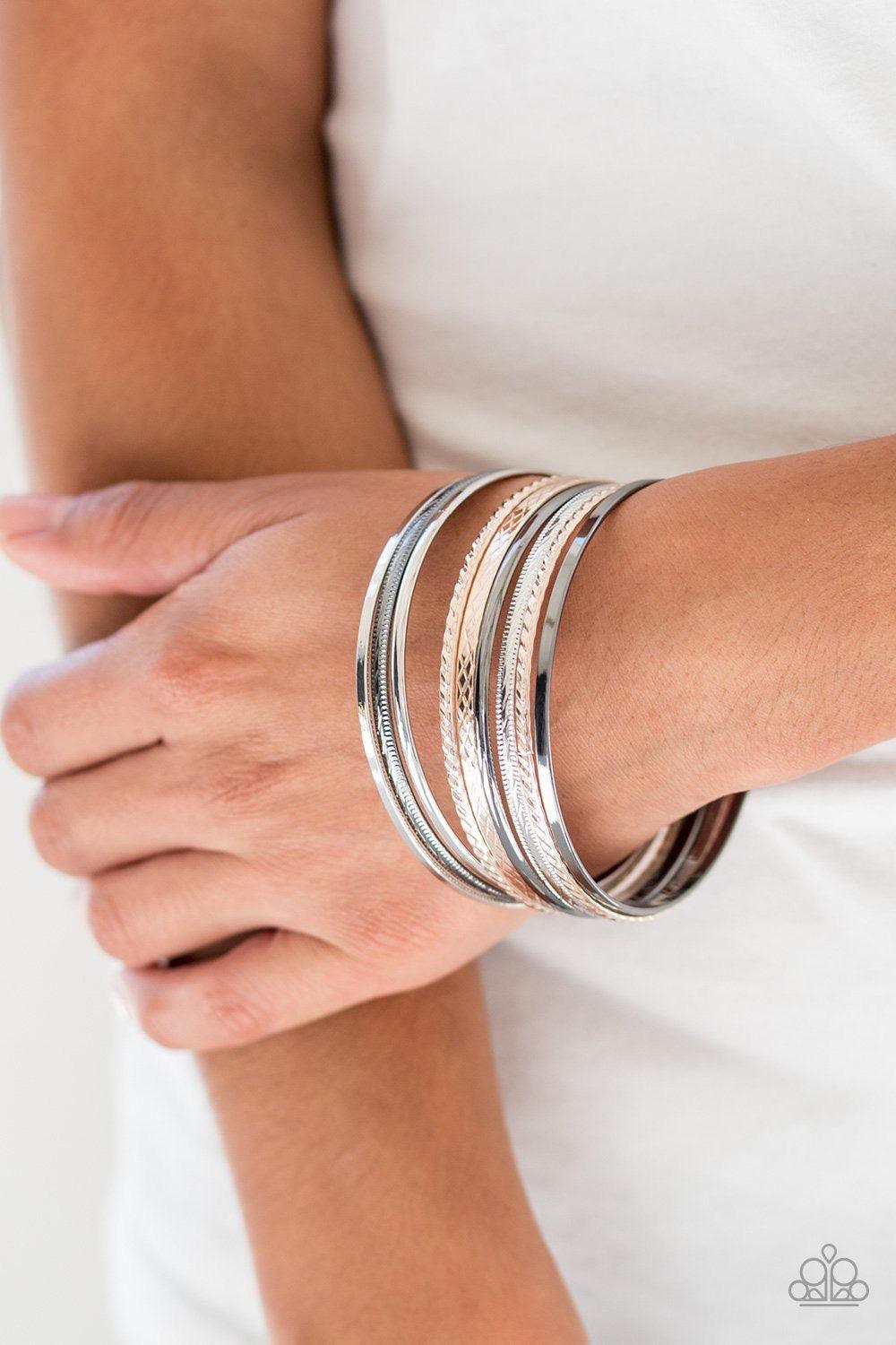 Paparazzi Accessories Am I Bright - Multi Featuring smooth and textured finishes, a collection of mismatched silver, rose gold, and gunmetal bangles stack across the wrist for a classic look. Jewelry