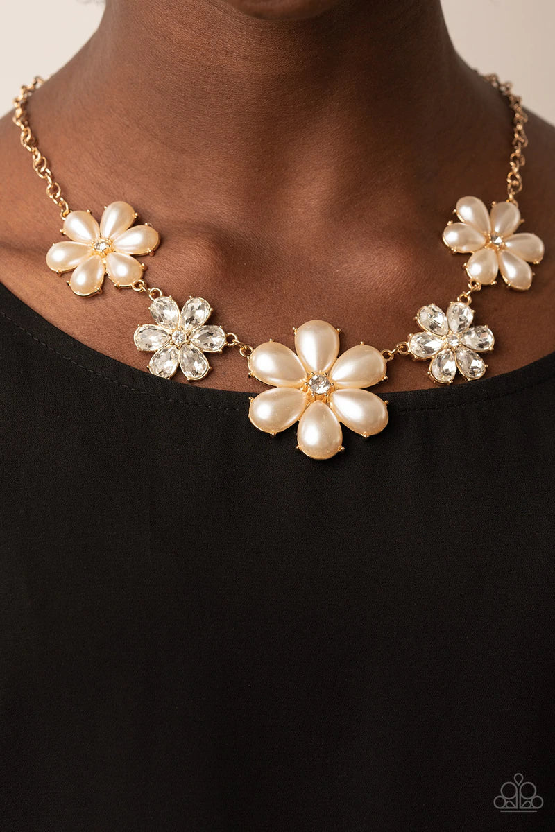 Paparazzi Accessories Fiercely Flowering - Gold Featuring glassy white rhinestone centers, bubbly pearl petaled gold flowers gradually increase in size as they alternate with white rhinestone petaled flowers below the collar for a fierce floral fashion. F
