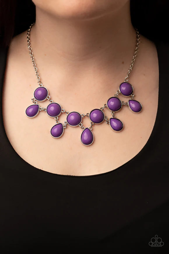 Paparazzi Accessories Very Valley Girl - Purple A vivacious collection of purple teardrop beads links to the bottom row of oversized round purple beads, interlocking into a glamorous pop of color below the collar. Features an adjustable clasp closure. Sol