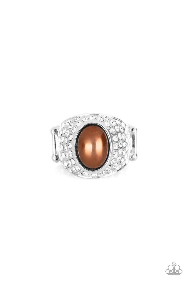 Paparazzi Accessories Glittering Go-Getter - Brown A pearly brown bead is pressed into the center of a bold silver band radiating with countless white rhinestones, creating a dramatic statement piece atop the finger. Features a stretchy band for a flexibl