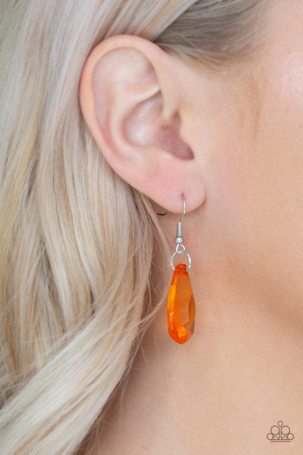 Paparazzi Accessories Irresistible Iridescence - Orange Glassy orange teardrops and glassy orange beads swing from the bottom of a shimmery silver chain. Matching beads trickle down free-falling chains, creating a glamorous fringe below the collar. Featur