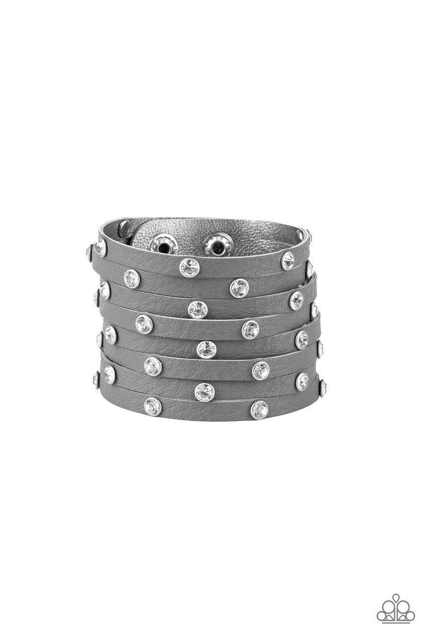 Paparazzi Accessories Sass Squad - Silver A thick gray leather band has been spliced into numerous gray strands. Featuring sleek silver frames, glittery white rhinestones are sprinkled across the leather bands for a sassy finish. Features an adjustable sn