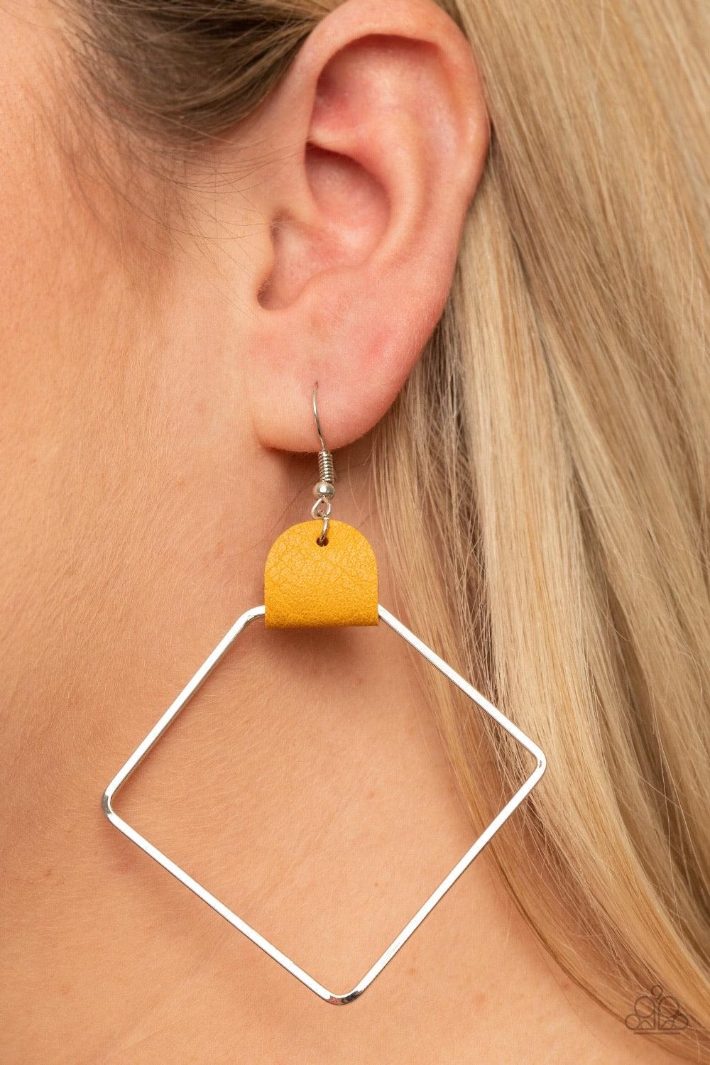 Paparazzi Accessories Friends of a LEATHER - Yellow An airy geometric silver hoop is pinched between a dainty piece of golden yellow leather, creating an edgy lure. Earring attaches to a standard fishhook fitting. Sold as one pair of earrings. Jewelry