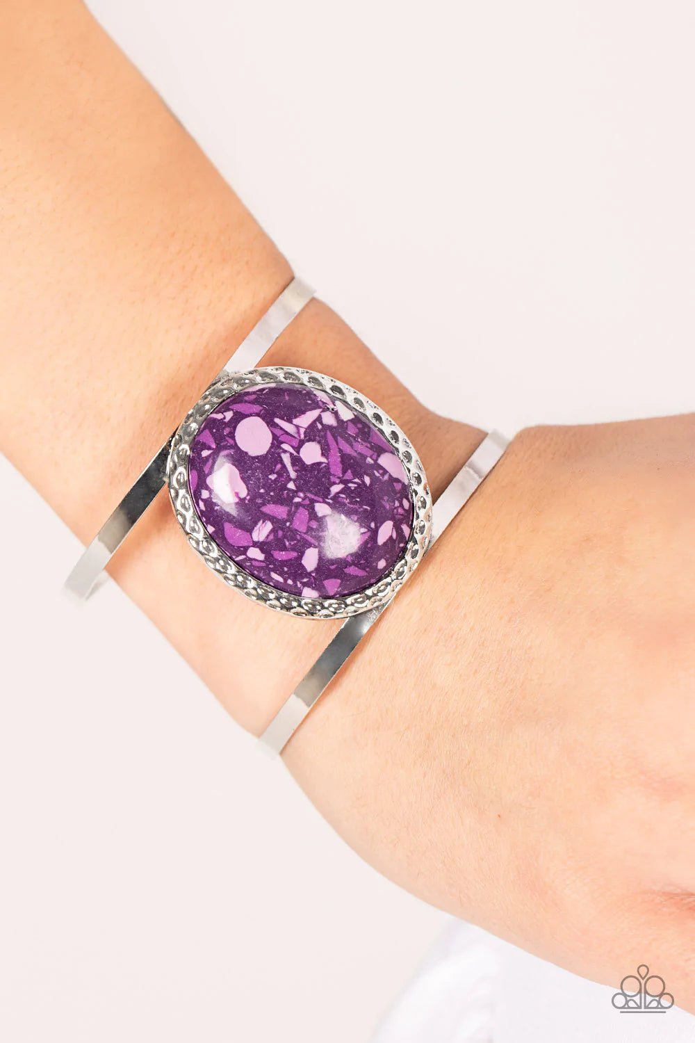 Paparazzi Accessories Tantalizing Terrazzo - Purple Featuring a colorful terrazzo finish, an oversized purple stone is pressed into the center of a hammered silver frame atop a layered silver cuff for a modern stone look. Sold as one individual bracelet.