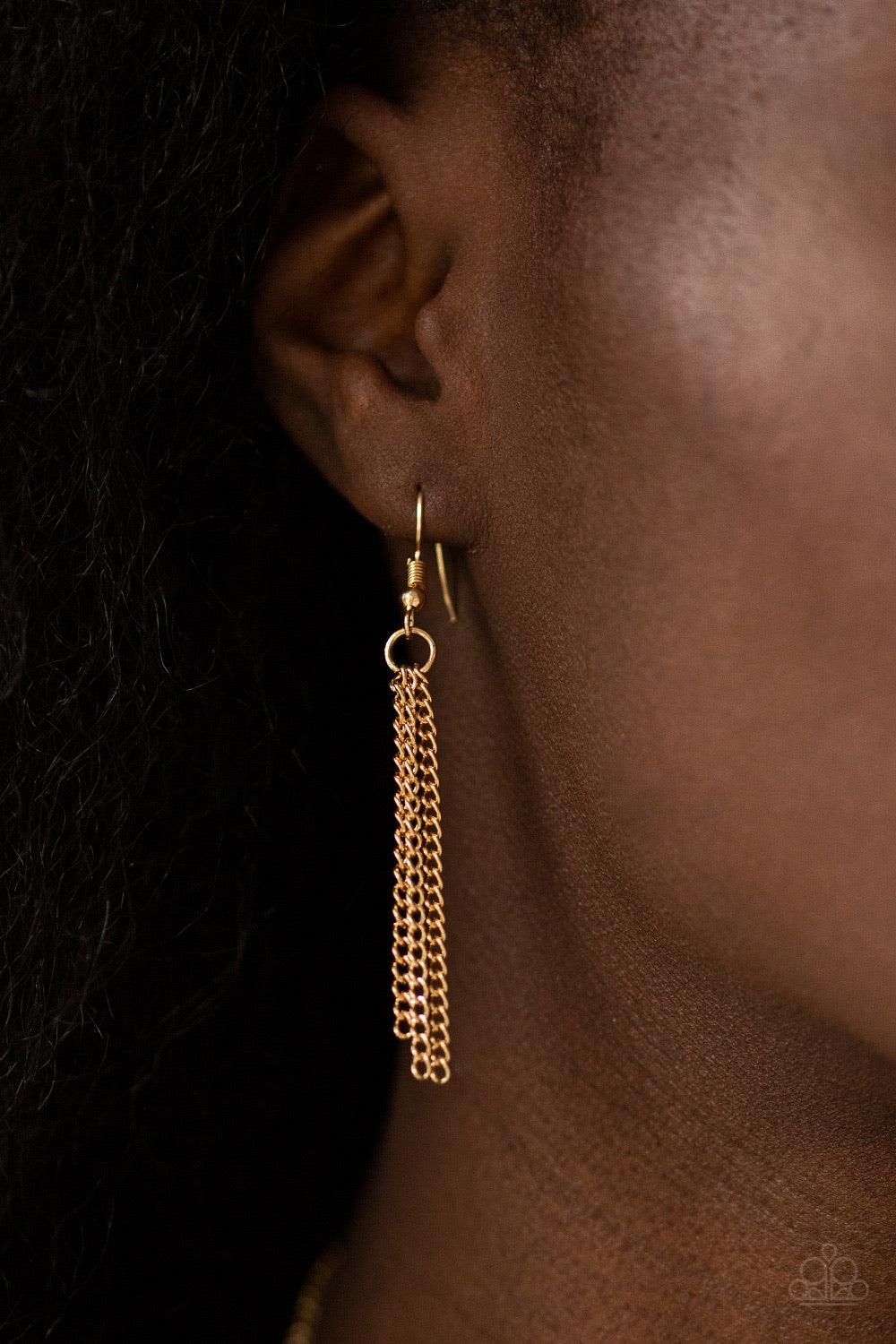 Paparazzi Accessories Way To Make An Entrance ~Gold Cut into an alluring teardrop, an oversized white rhinestone gem attaches to bold gold frames radiating with glassy white rhinestones. The dramatic pendant attaches to doubled gold chains, swinging horiz