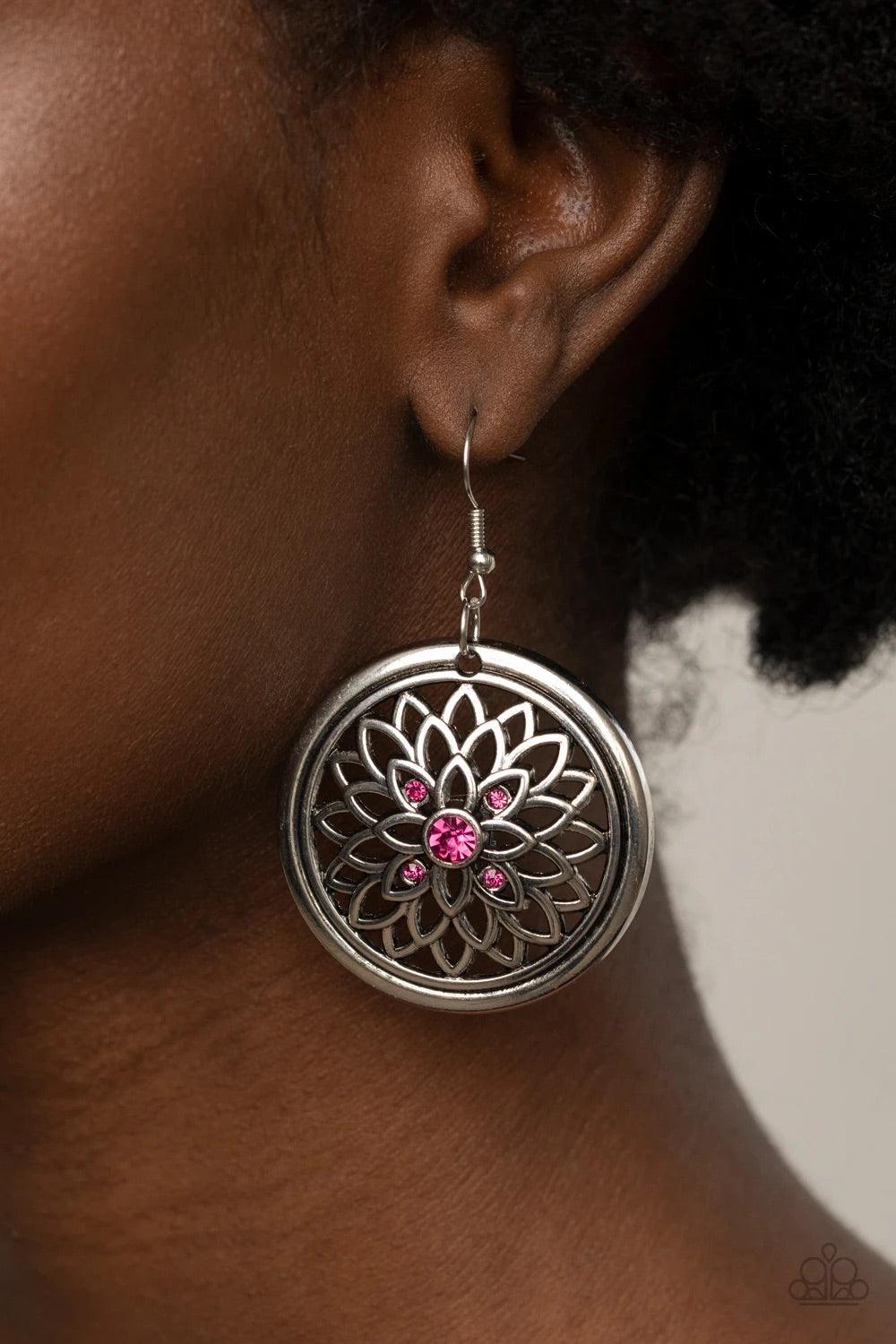 Paparazzi Accessories Mega Medallions - Pink Dotted with a glittery pink rhinestone center, airy silver petals bloom across the front of a rustic silver hoop, creating a sparkly medallion-like frame. Earring attaches to a standard fishhook fitting. Sold a