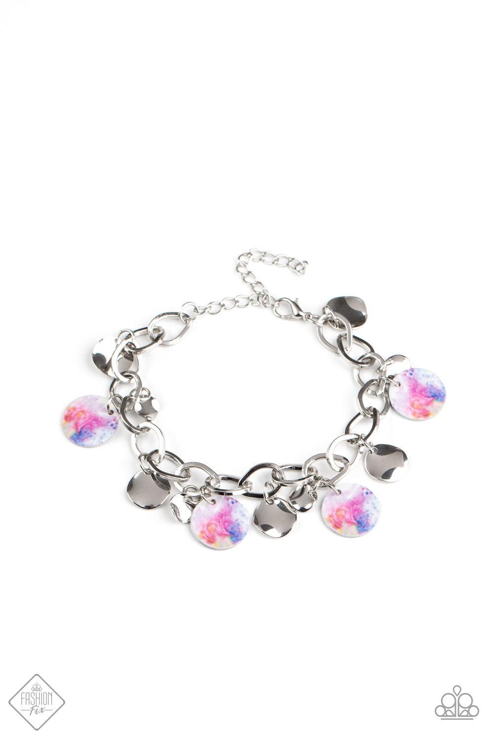 Paparazzi Accessories Teasingly Tie Dye ~Multi Featuring a galactic tie dye print, a collection of colorful and dainty silver discs swings from a bulky silver chain around the wrist for a trendy finish. Features an adjustable clasp closure. Sold as one in