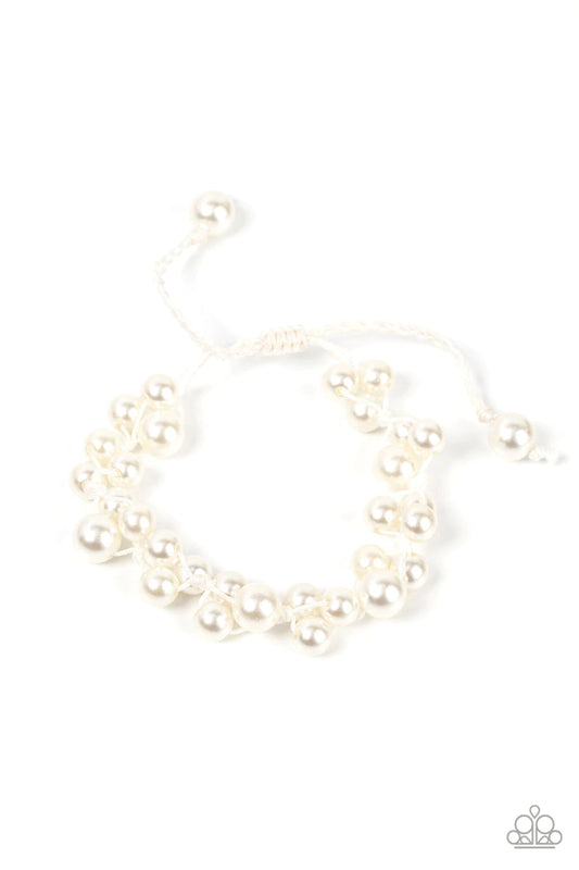 Paparazzi Accessories Vintage Versatility - White Bubbly clusters of white pearls are decoratively knotted around the wrist, adding a timeless twist to the elegant centerpiece. Features an adjustable sliding knot closure. Sold as one individual bracelet.