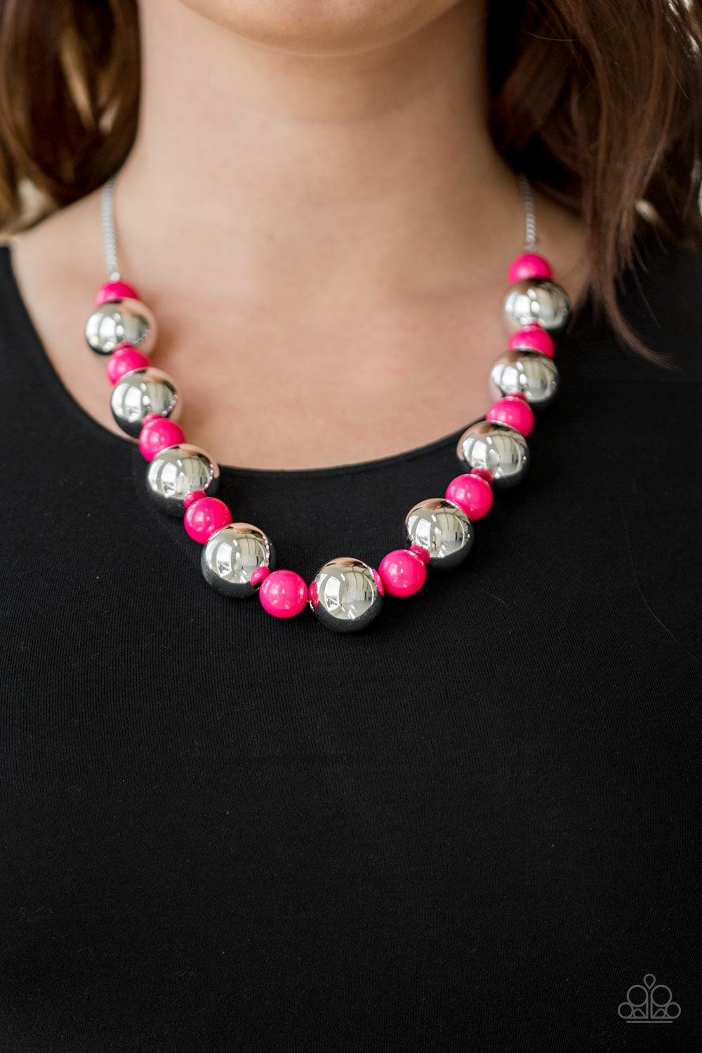 Paparazzi Accessories Top Pop - Pink Polished pink beads and dramatic silver beads drape below the collar for a perfect pop of color. Features an adjustable clasp closure. Jewelry