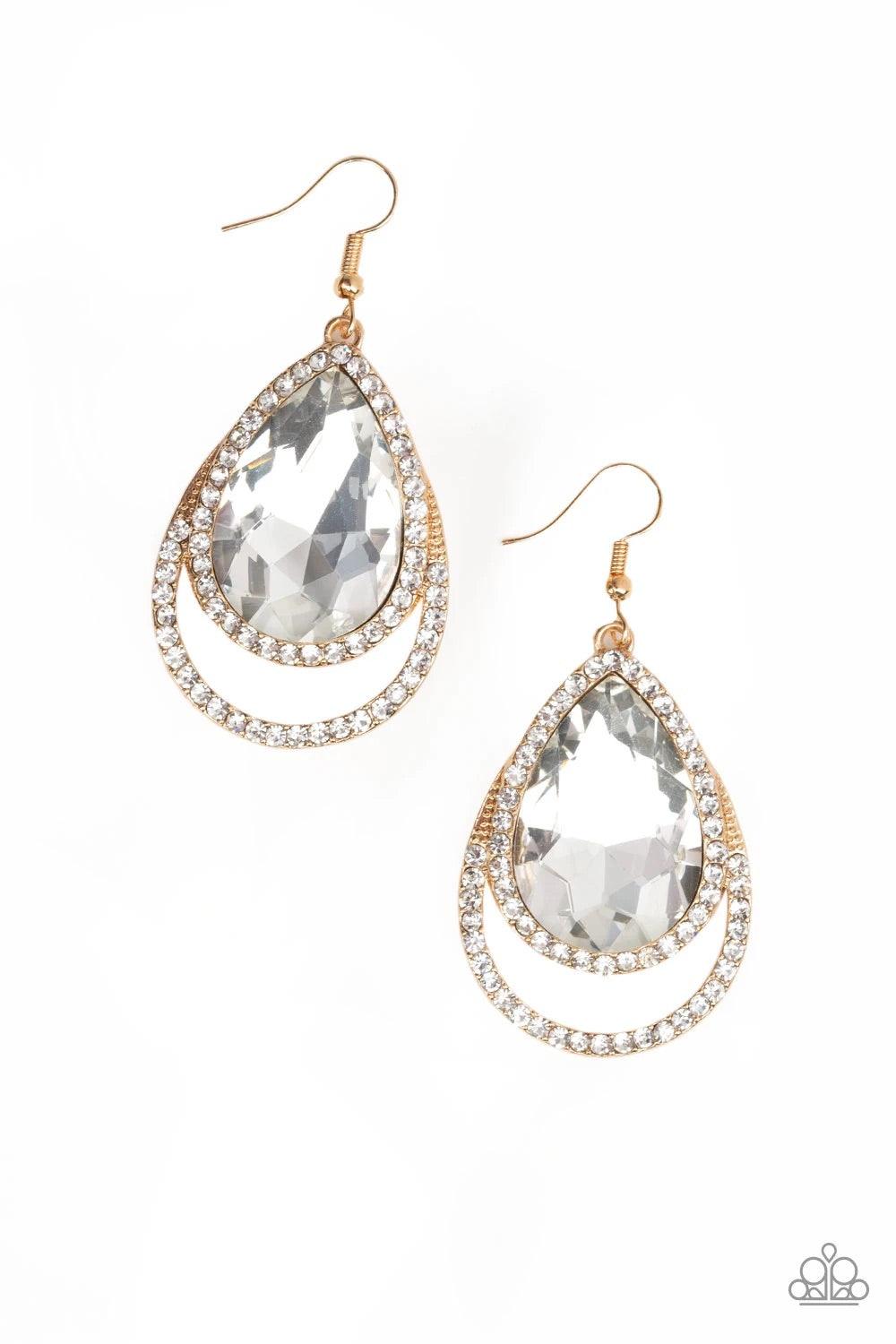 Paparazzi Accessories Famous - Gold A dramatically oversized white teardrop gem is pressed into a doubled gold frame encrusted in countless white rhinestones for a blinding look. Earring attaches to a standard fishhook fitting. Sold as one pair of earring