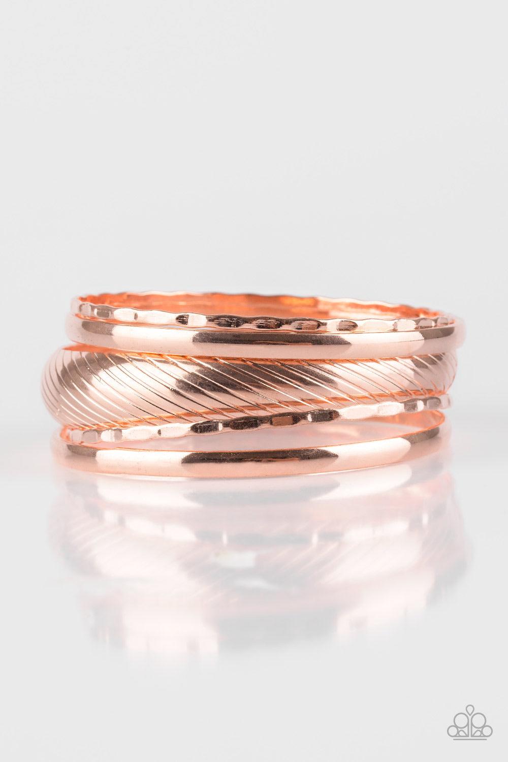 Paparazzi Accessories Boss of Boho - Copper Featuring serrated and smooth surfaces, mismatched shiny copper bangles stack across the wrist for a casual look. Jewelry