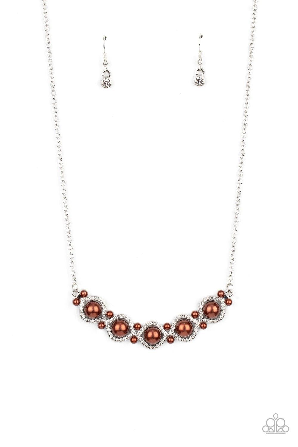 Paparazzi Accessories Life Of The Wedding Party - Brown Enhanced with pairs of dainty brown pearls, white rhinestone encrusted silver bars interweave around bubbly brown pearl-drop centers, creating a refined pendant below the collar. Features an adjustab