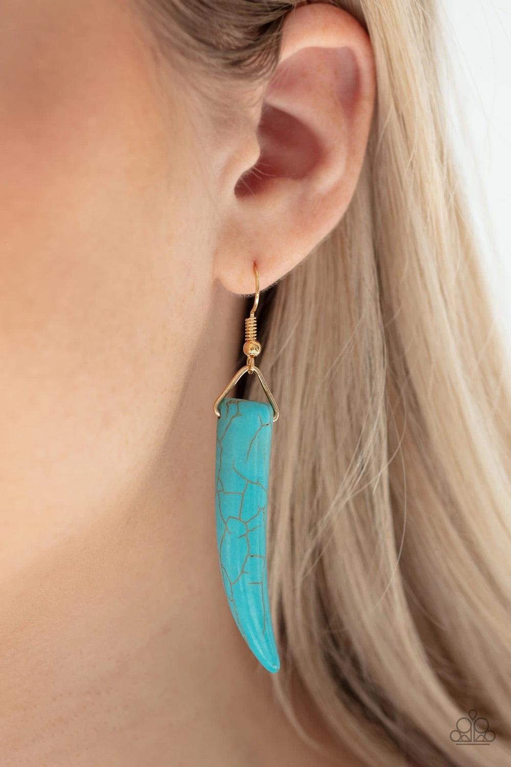 Paparazzi Accessories Tusk Tundra - Blue Infused with dainty gold beads, tusk-shaped turquoise stone beads are threaded along an invisible wire below the collar, creating a wild fringe. Features an adjustable clasp closure. Sold as one individual necklace