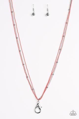Paparazzi Accessories Colorfully Chic - Orange *Lanyard Painted in a refreshing coral finish, dainty ball-chains and a shimmery silver satellite chain drapes across the chest for a colorful industrial look. A lobster clasp hangs from the bottom of the des