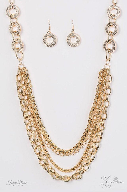Paparazzi Accessories The Melissa Encrusted in glittery white rhinestones, glistening gold frames give way to layers of shimmery gold chains. Varying in size and shimmer, the bold assortment of gold chains drape across the chest in a fierce and flawless f