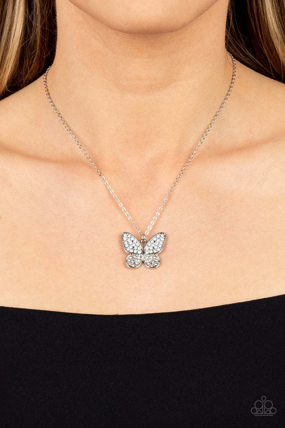 Paparazzi Accessories Flutter Forte - White Dotted in opalescent and glassy white rhinestones, a whimsical silver butterfly flutters along a dainty silver chain below the collar for an enchanting fashion. Features an adjustable clasp closure. Sold as one