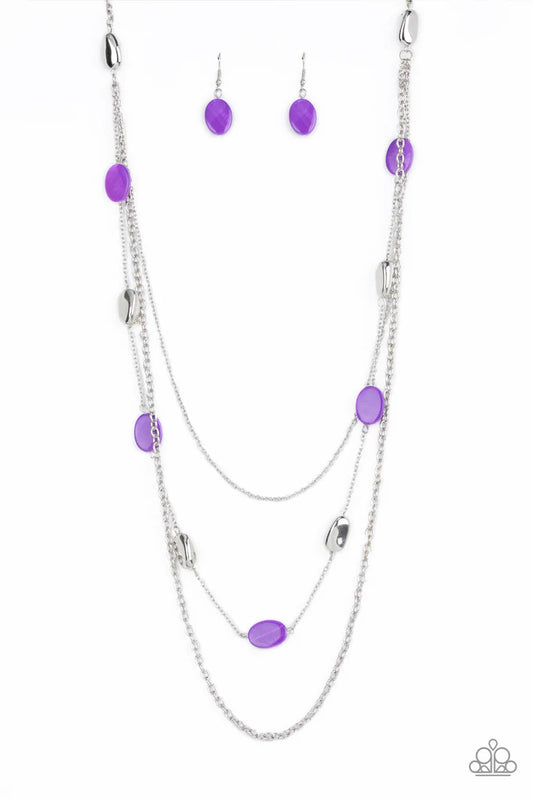 Paparazzi Accessories Barefoot and Beachbound - Purple A strand of silver pebble beads and purple shell-like discs layer with two mismatched silver chain across the chest, adding a seasonal pop of color to any outfit. Features an adjustable clasp closure.