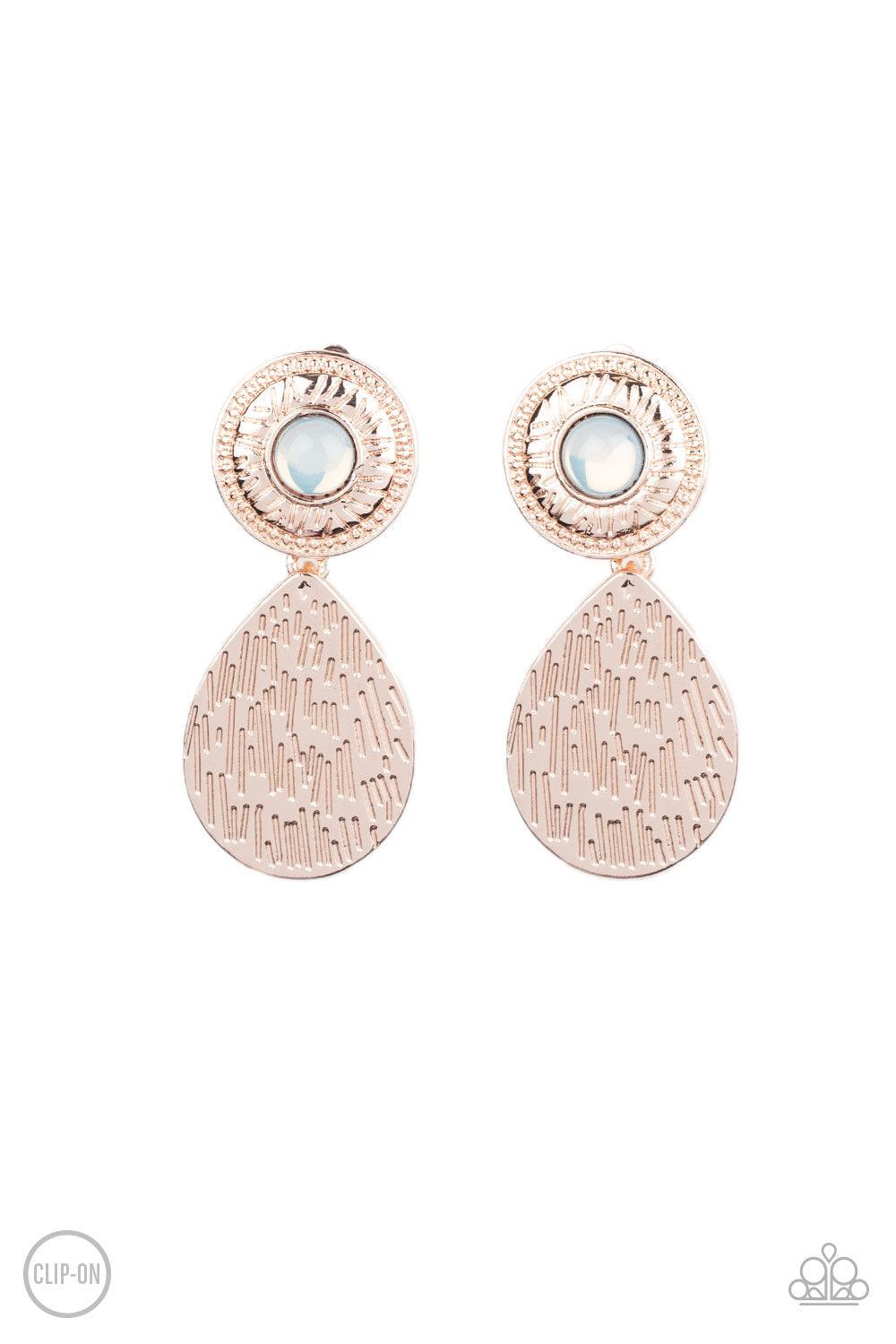 Paparazzi Accessories Emblazoned Edge - Rose Gold *Clip-On A hammered rose gold teardrop dangles from the bottom of an ornate rose gold disc that is dotted with a dreamy opal beaded center. Earring attaches to a standard clip-on fitting. Sold as one pair