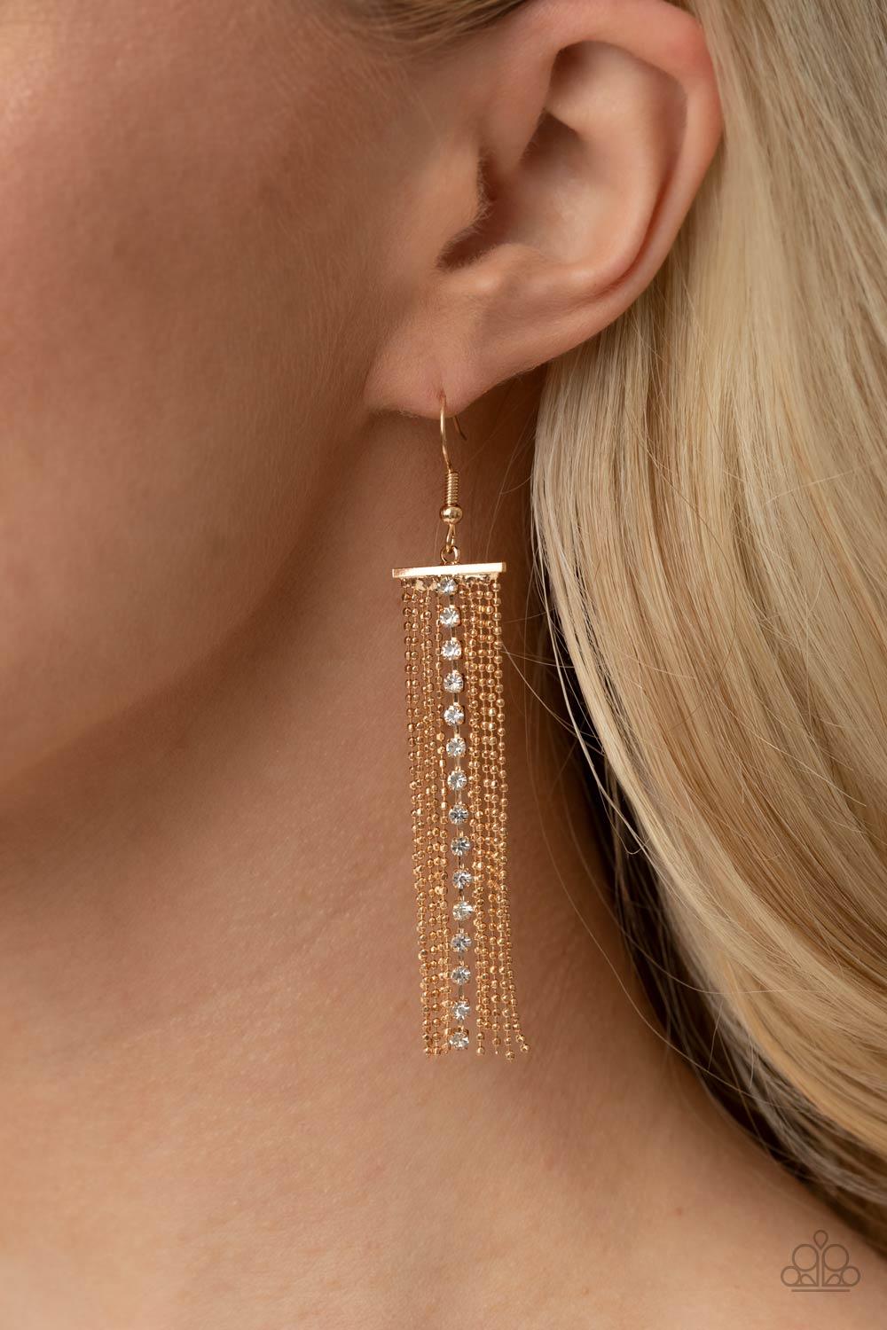 Paparazzi Accessories Another Day, Another DRAMA - Gold Infused with a strand of glassy white rhinestones, rows of dainty gold ball chains cascade from a dainty gold fitting, creating a refined tassel. Earring attaches to a standard fishhook fitting. Sold