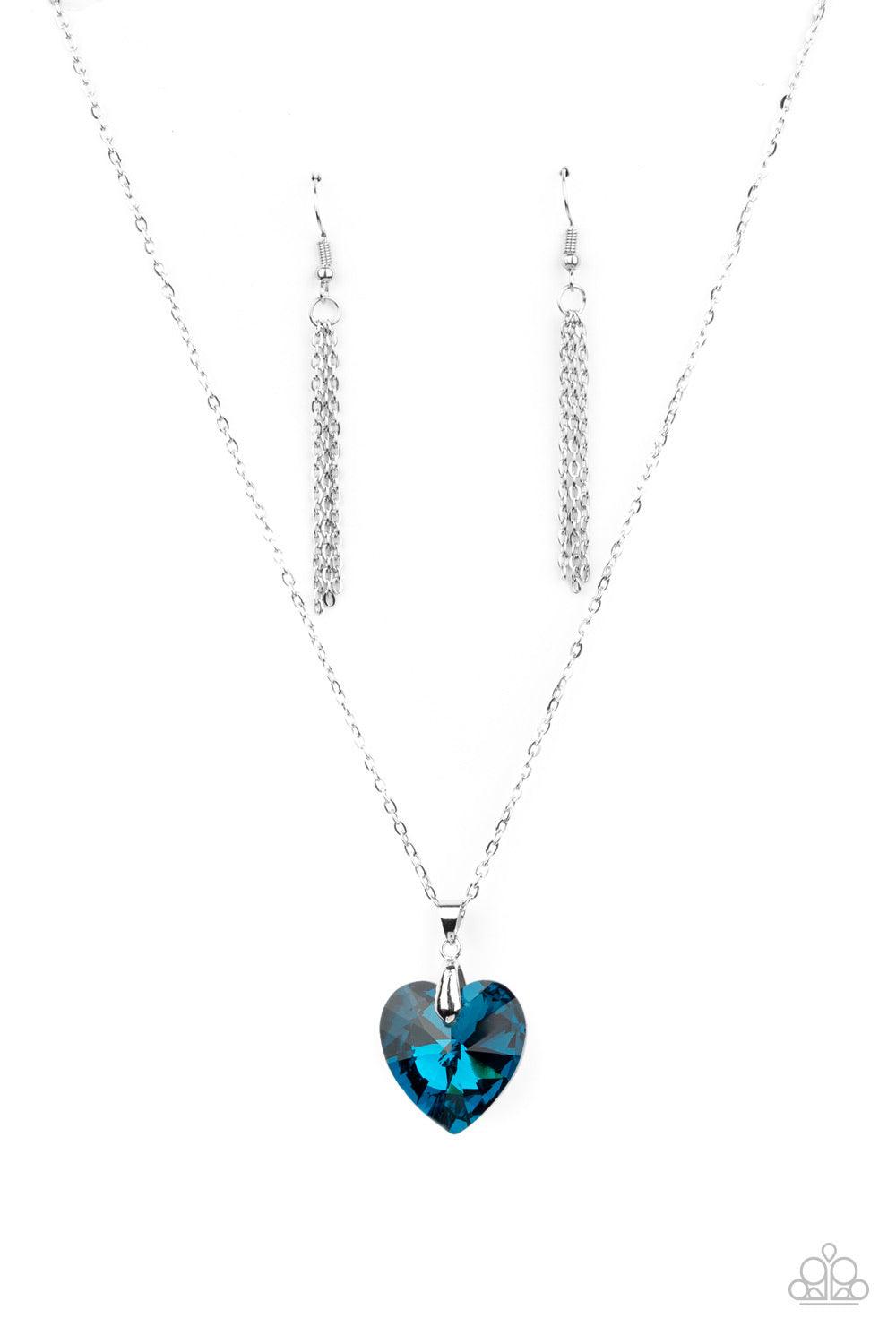 Paparazzi Accessories Love Hurts - Blue Chiseled into a charming heart, an oversized blue gem slides along a dainty silver chain below the collar for a flirtatious finish. Features an adjustable clasp closure. Sold as one individual necklace. Includes one