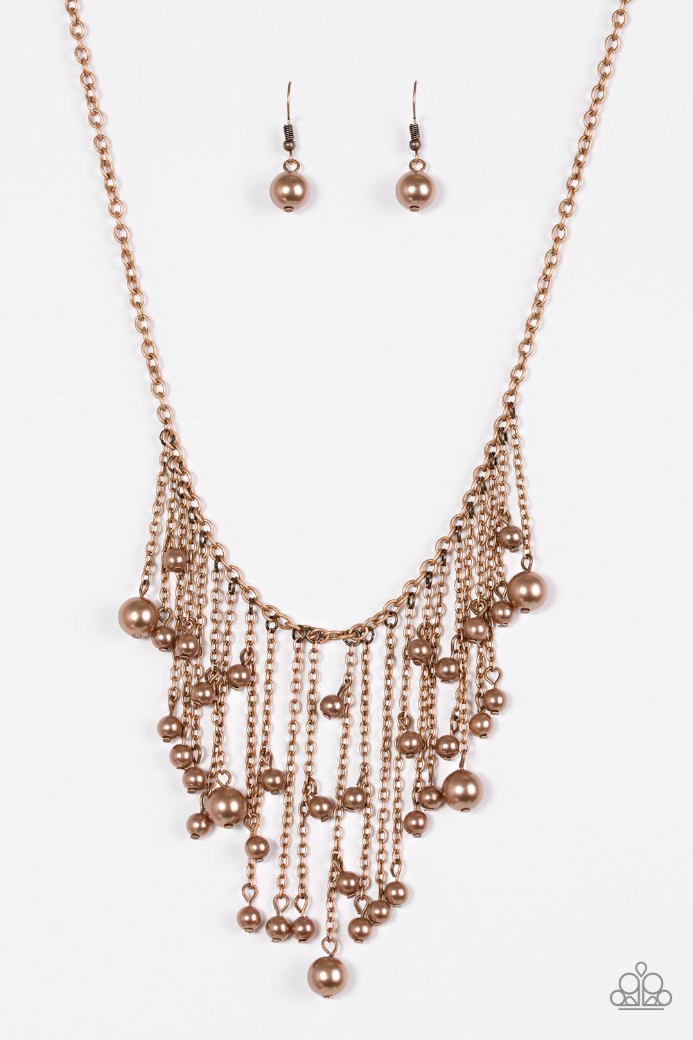 Paparazzi Accessories Catwalk Champ - Copper Varying in length, glistening copper chains swing from the bottom of a bold copper chain. Pearly copper beads trickle down the chains, creating a fierce fringe below the collar. Features an adjustable clasp clo