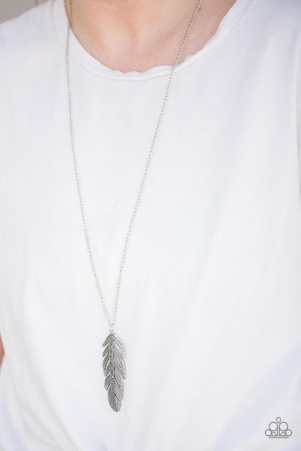 Paparazzi Accessories Sky Quest - Silver Glittery hematite rhinestones are encrusted down the spine of a life-like silver feather. The whimsical pendant swings from the bottom of a lengthened silver chain for a seasonal look. Features an adjustable clasp