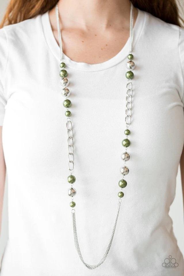 Paparazzi Accessories Uptown Talker - Green Varying in size, pearly green and oversized silver beads give way to sections of bold silver chain. Layers of silver chains drape across the bottom of the design for a flawless finish. Features an adjustable cla