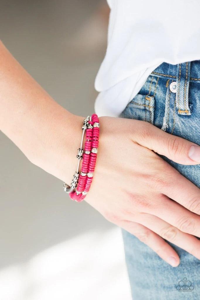 Paparazzi Accessories Tribal Spunk - Pink Mismatched silver accents and disc shaped pink beading slides along stretchy spring-like wires for a spunky tribal look. Sold as one set of four bracelets. Jewelry
