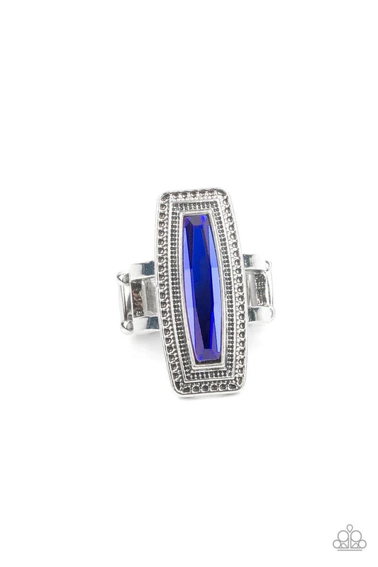 Paparazzi Accessories Luminary Luster - Blue An elongated UV gem is pressed into the center of a studded silver frame atop layered silver bands, creating a stellar centerpiece atop the finger. Features a stretchy band for a flexible fit. Sold as one indiv