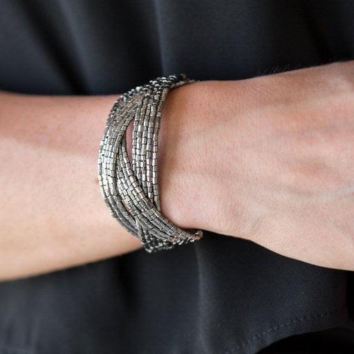 Paparazzi Accessories Shooting Stars ~Gunmetal Layers of gunmetal seed beads are braided together to create a breathtaking cuff design that shimmers brilliantly along the wrist.