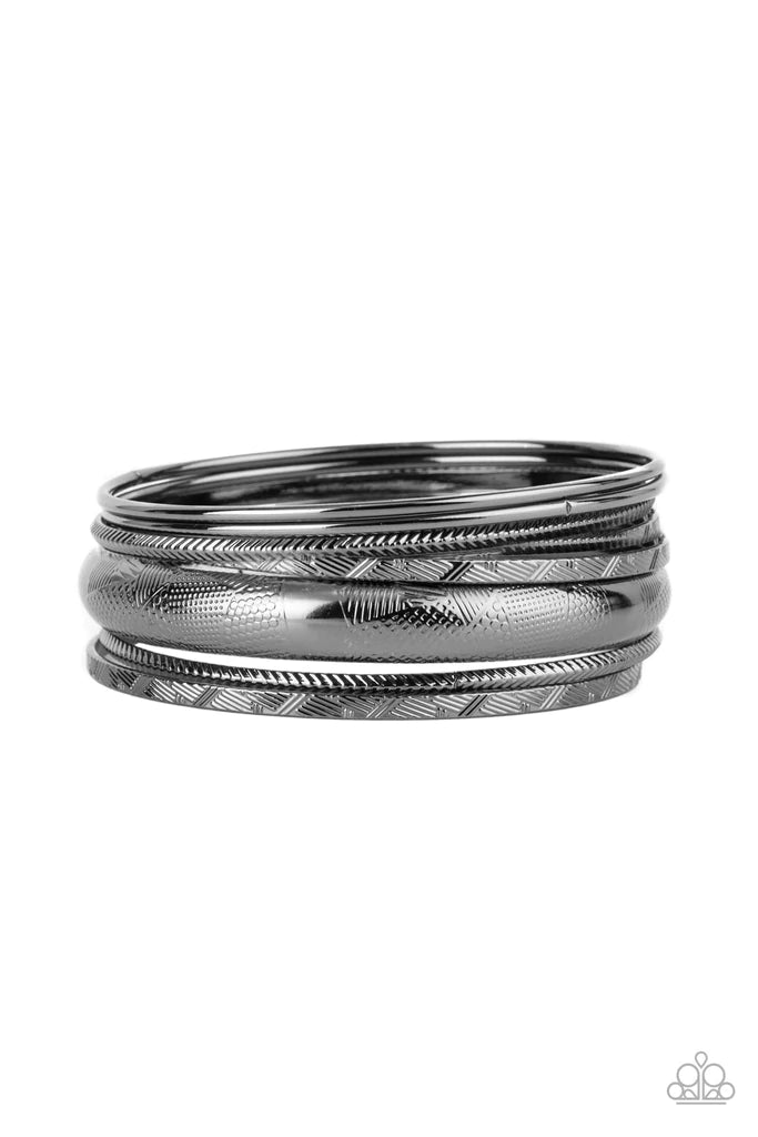 Paparazzi Accessories Stackable Stunner - Black A jangling symphony of classic gunmetal bangles featuring shiny and textured finishes and varying sizes stack up the wrist for a layered look. Sold as one set of seven bracelets. Jewelry