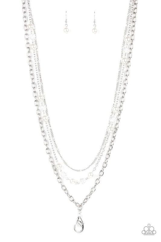 Paparazzi Accessories GLEAM Work - White *Lanyard Dotted with sections of white pearls and glassy crystal-like accents, mismatched layers of shimmery silver chain layer across the chest for a refined flair. A lobster clasp hangs from the bottom of the des