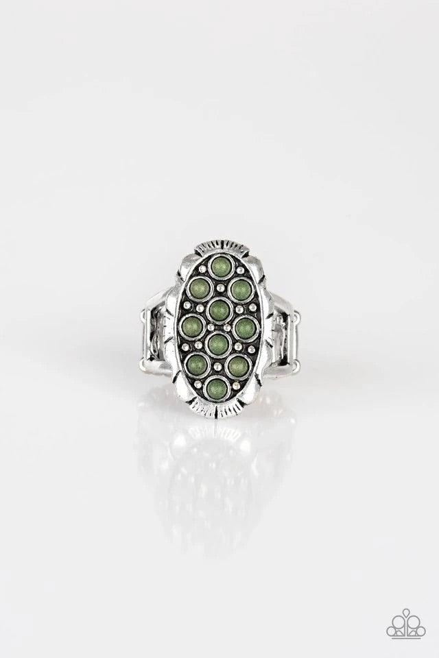 Paparazzi Accessories Cactus Garden - Green Dainty green stones are sprinkled across the front of a studded silver frame, creating a refreshing centerpiece atop the finger. Features a stretchy band for a flexible fit. Jewelry