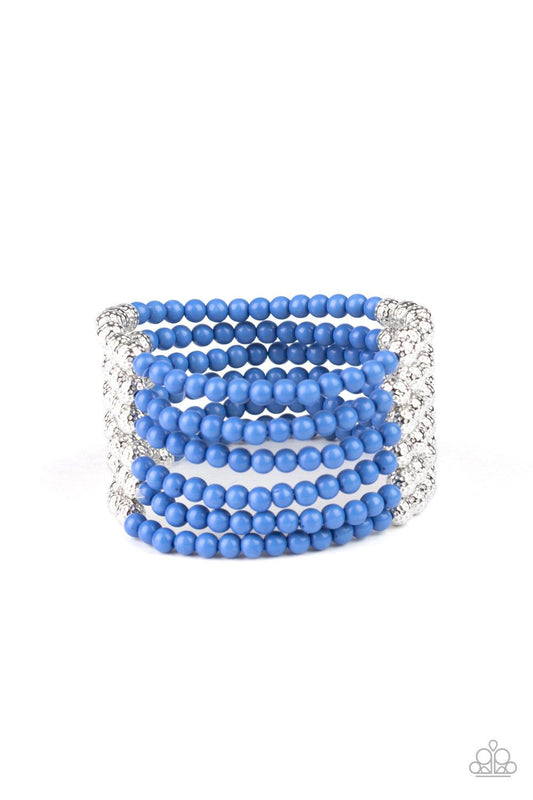 Paparazzi Accessories LAYER It On Thick - Blue Held together with silver fittings, row after row of ornate silver and polished blue beads are threaded along stretchy bands around the wrist of a colorful fashion. Jewelry