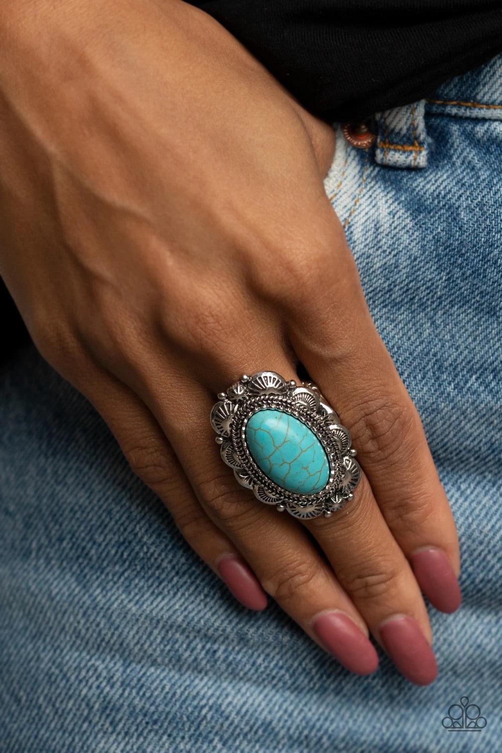 Paparazzi Accessories Bring Down The RANCH House - Blue An oval turquoise stone sits atop a scalloped silver frame decoratively embossed and stamped in rustic patterns, creating a whimsical stone centerpiece atop the finger. Features a stretchy band for a